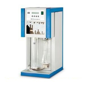 Laboratory distillation equipment being checked during inspection service