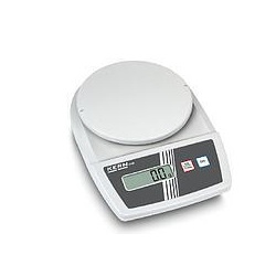 Technician performing calibration on a precision weighing instrument