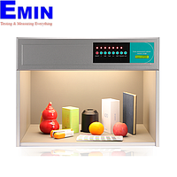 Technician servicing a color assessment cabinet used for controlled visual color inspection