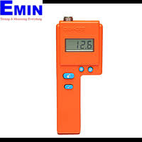 Technician handling a moisture measurement instrument for textile-related calibration work